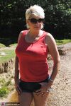 Hot mature lady Dimonty fondles her natural tits in bikini bottoms