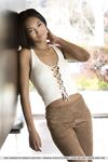 Ebony babe Noel Monique exposing small breasts for glamour photo shoot