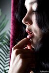 Nude brunette teen Malena Fendi shows off her bare feet with toes splayed