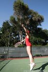 Sexy Penny Flame entices with ass & cleavage in tight dress on a tennis court