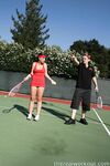 Sexy Penny Flame entices with ass & cleavage in tight dress on a tennis court