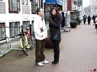Visiting sex tourist pick up a couple of hookers from the red light district