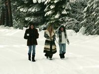 Three big boobed stunners pose braless in their fur coats in the snow