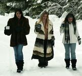 Three big boobed stunners pose braless in their fur coats in the snow