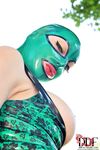 Solo girl Latex Lucy exposing huge tits from latex uniform outdoors