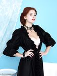Long legged vintage pinup girl showing hot tits wearing stockings & corset