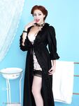 Long legged vintage pinup girl showing hot tits wearing stockings & corset
