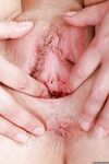Brunette solo girl Alex Black exposes large all natural tits and bald cunt