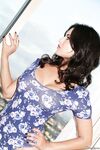 Curly-haired brunette Sunny Leone is playing with her anal toys