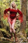 Mature amateur shows her bare ass after undressing in old growth forest