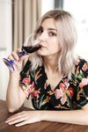 Amateur girl Eva Elfie gets totally naked after drinking wine at kitchen table