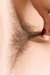 Hairy pussy and armpits of teen brunette girl Polina in close-up pictures