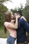 2 girls in denim shorts meet up with a black man for an outdoor threesome