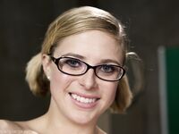 Nerdy pornstar Penny Pax shows her natural tits and poses in sheer pantyhose