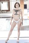 Busty tattooed Harlow Harrison drenched in oil fingers sexy ass on yoga mat