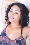 Hot black girl Millie Stone disrobes before showcasing her pink pussy