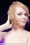 Smiley faced teen Feeona A revealing toned body parts in the nude
