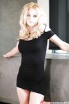 Clothed babe blonde Riley Steele is slowly showing her ass!