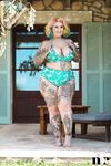 Inked BBW with rainbow hair Galda Lou exposes her huge melons and big butt