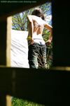 Hidden voyeur spies on naked girl getting dressed outdoors