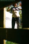 Hidden voyeur spies on naked girl getting dressed outdoors