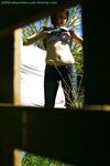 Hidden voyeur spies on naked girl getting dressed outdoors