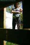 Hidden voyeur spies on naked girl getting dressed outdoors