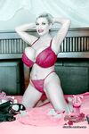 Mature lady with short hair Claudia Marie uncups huge tits before masturbating