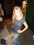Petite MILF Jolene Devil moans with pleasure as she masturbates on the sofa