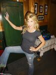 Petite MILF Jolene Devil moans with pleasure as she masturbates on the sofa