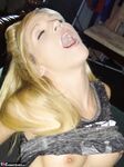 Petite MILF Jolene Devil moans with pleasure as she masturbates on the sofa