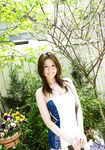 Sexy Japanese girl Tatsumi Yui holds an umbrella while standing naked