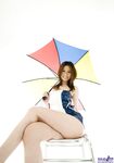 Sexy Japanese girl Tatsumi Yui holds an umbrella while standing naked