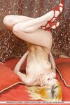 Slender Euro girl displaying shaved pussy in acrobatic positions