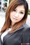 Attractive Japanese MILF Yuria Kanno posing in public in her sexy uniform