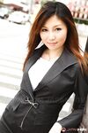 Attractive Japanese MILF Yuria Kanno posing in public in her sexy uniform