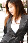 Attractive Japanese MILF Yuria Kanno posing in public in her sexy uniform