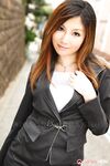 Attractive Japanese MILF Yuria Kanno posing in public in her sexy uniform