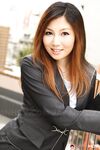 Attractive Japanese MILF Yuria Kanno posing in public in her sexy uniform