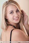 Blonde babe displaying sexy teen ass in lingerie for glamour pictures