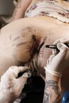 Alt chick Sully Savage spits out jizz after having her asshole tattooed