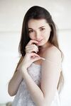 Beautiful young Lukki Lima undressing to finger her shaved pussy to orgasm