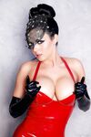 Stunning lady with big tits Isabella Fierra strips in latex gloves and dress