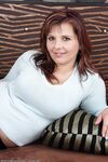 Chubby mature wife Marie Jeanne reveals nice big tits and spreads on her knees