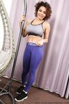 Curly haired beauty Billie C reveals her hot tits as she poses in the swing