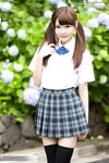 Cutie Japanese schoolgirl in pigtails shows naked ass in no panties upskirt
