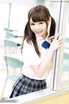 Cutie Japanese schoolgirl in pigtails shows naked ass in no panties upskirt