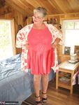 Short haired granny Girdle Goddess stripping to her stockings and high heels