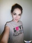 Cute brunette Emily undressing to take self shots of her bare tits and hot ass