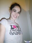 Cute brunette Emily undressing to take self shots of her bare tits and hot ass